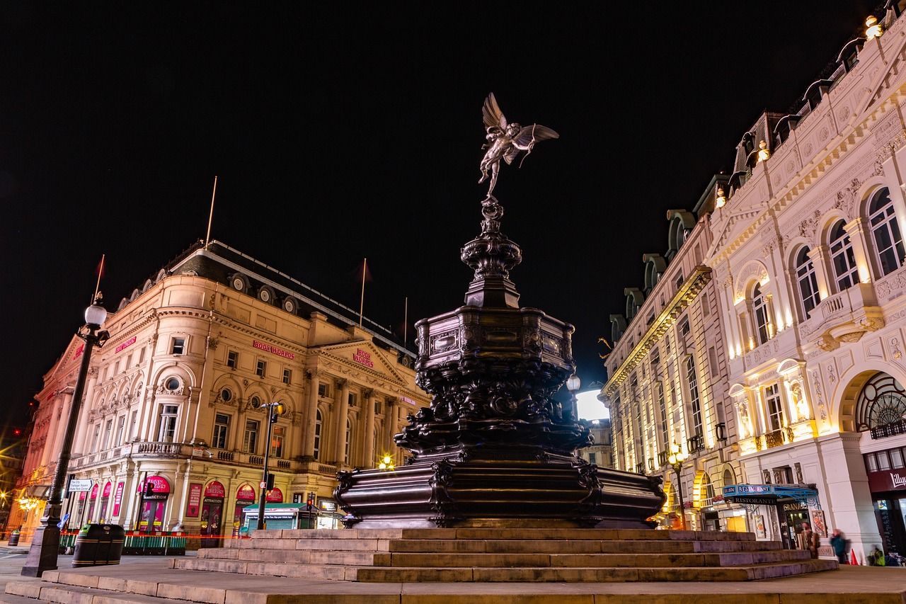 Piccadilly Circus at night, steps from The Comedy Store's permanent home