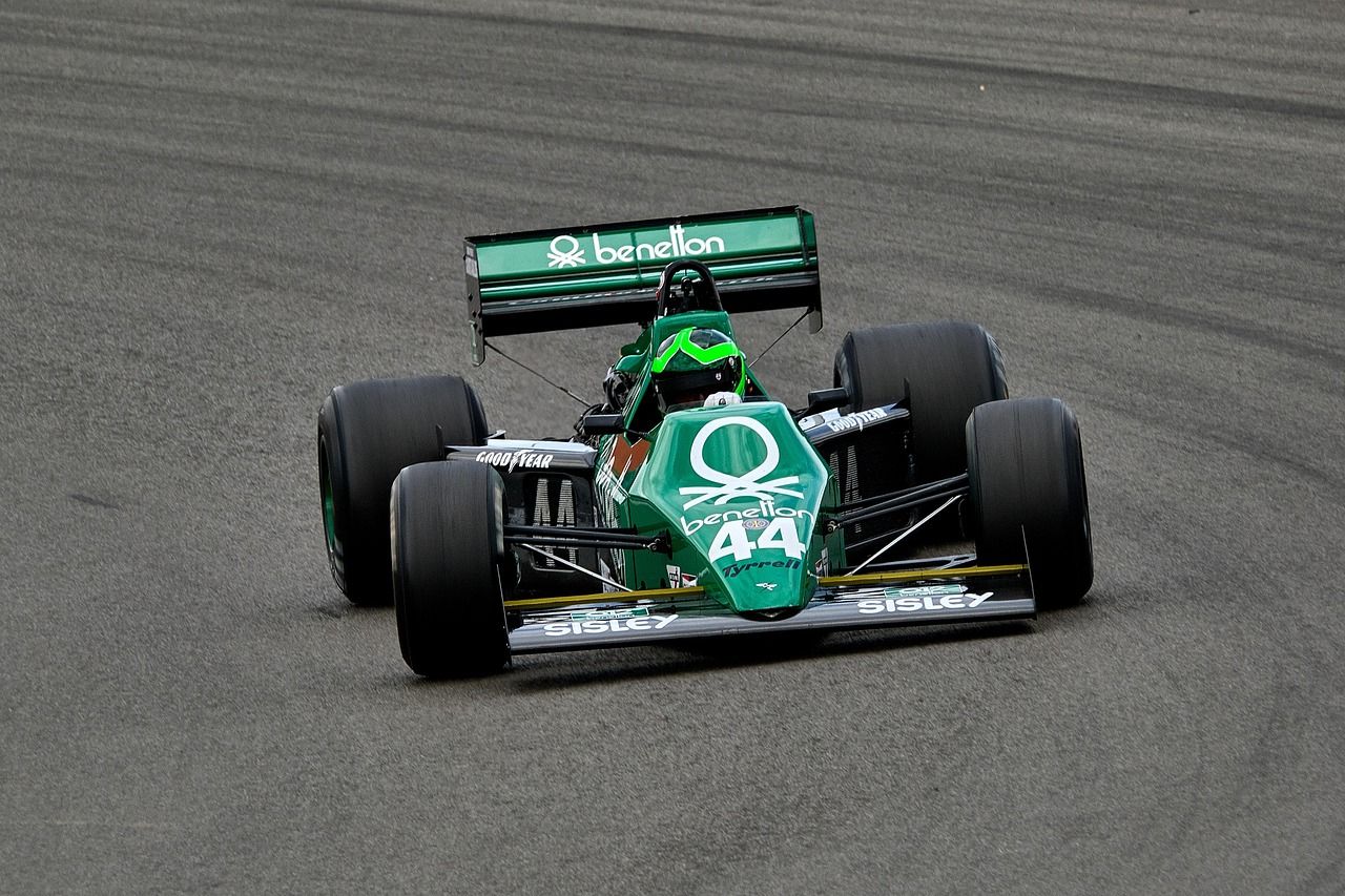 Vintage Formula 1 race car on a classic circuit, evoking the early days of racing at Imola