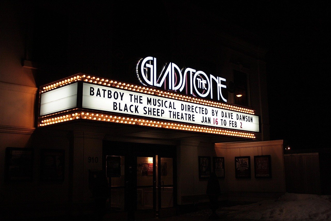 Broadway theatre marquee illuminated at night