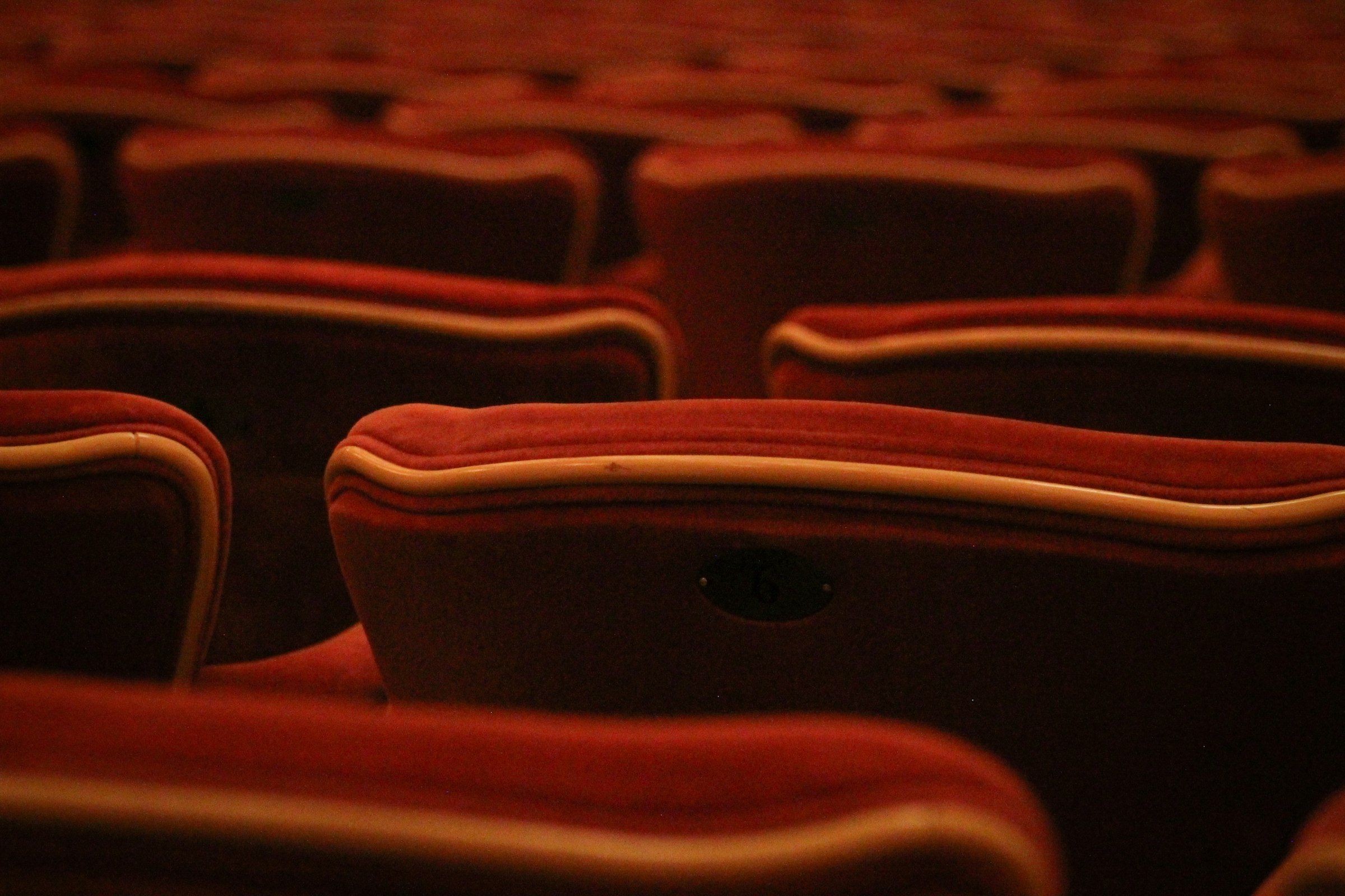 The Royal Opera House at Covent Garden (Rows of empty red theater seats)