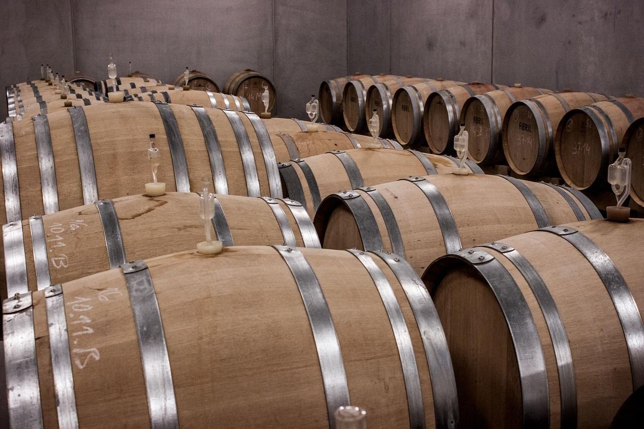 Wine barrels stacked in a traditional Bordeaux cellar