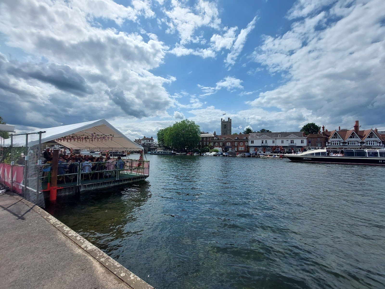 Henley Royal Regatta racing on the River Thames with the Regatta Enclosure behind