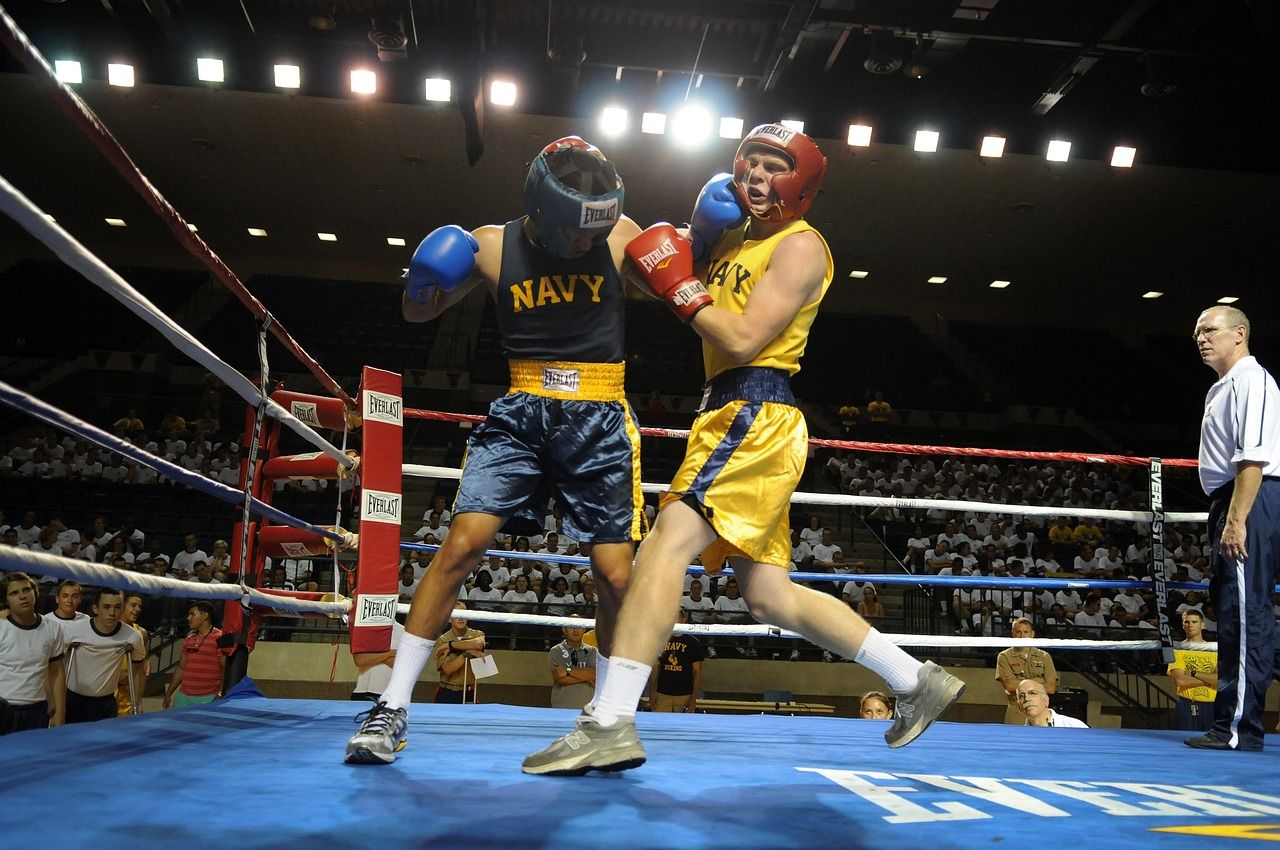 Close-up of boxing ring ropes, an empty ring symbolising absence from the sport