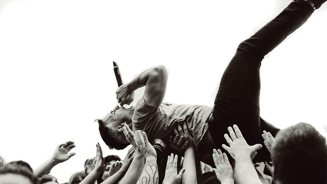 Live music festival with energetic crowd