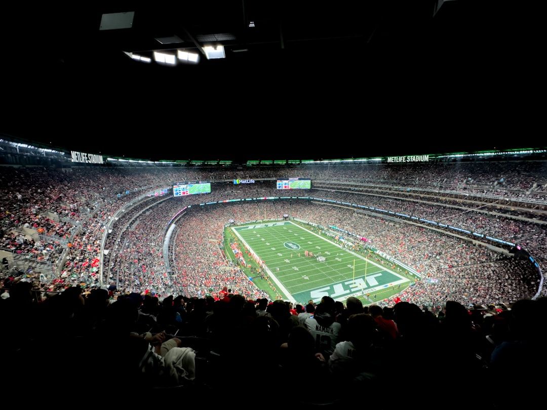 Super Bowl halftime show with packed stadium and dramatic stage lighting