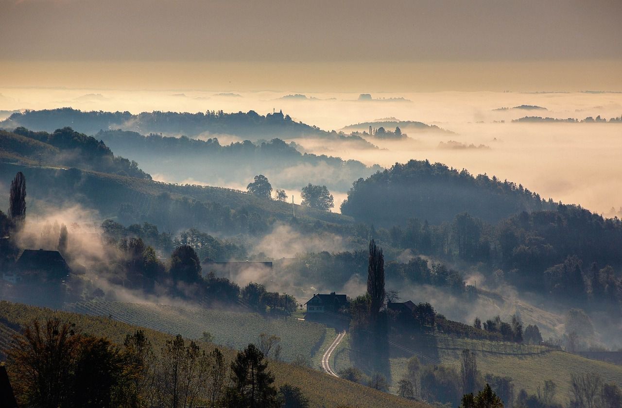 Misty Styrian landscape evoking the rain-soaked conditions of the 1975 Austrian Grand Prix