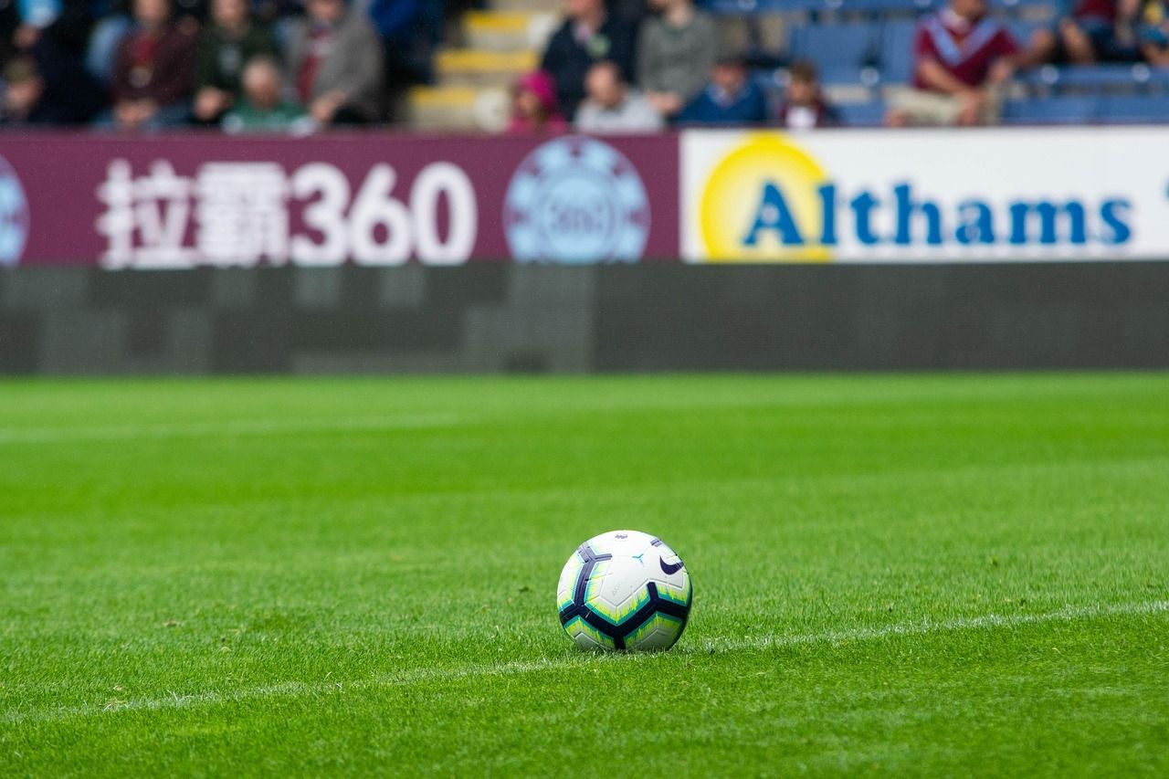 A pristine football pitch ready for a Premier League match