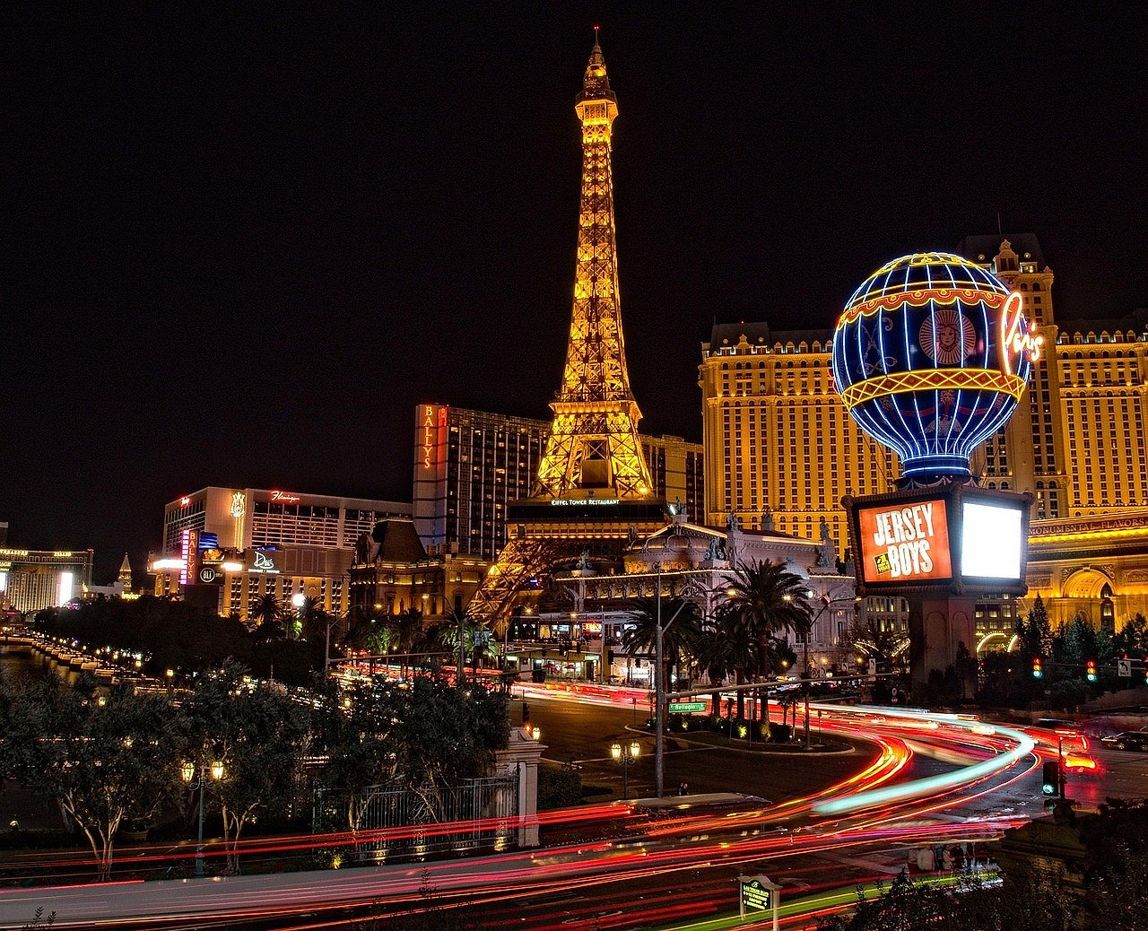 Las Vegas Strip illuminated at night, evoking the Rat Pack era