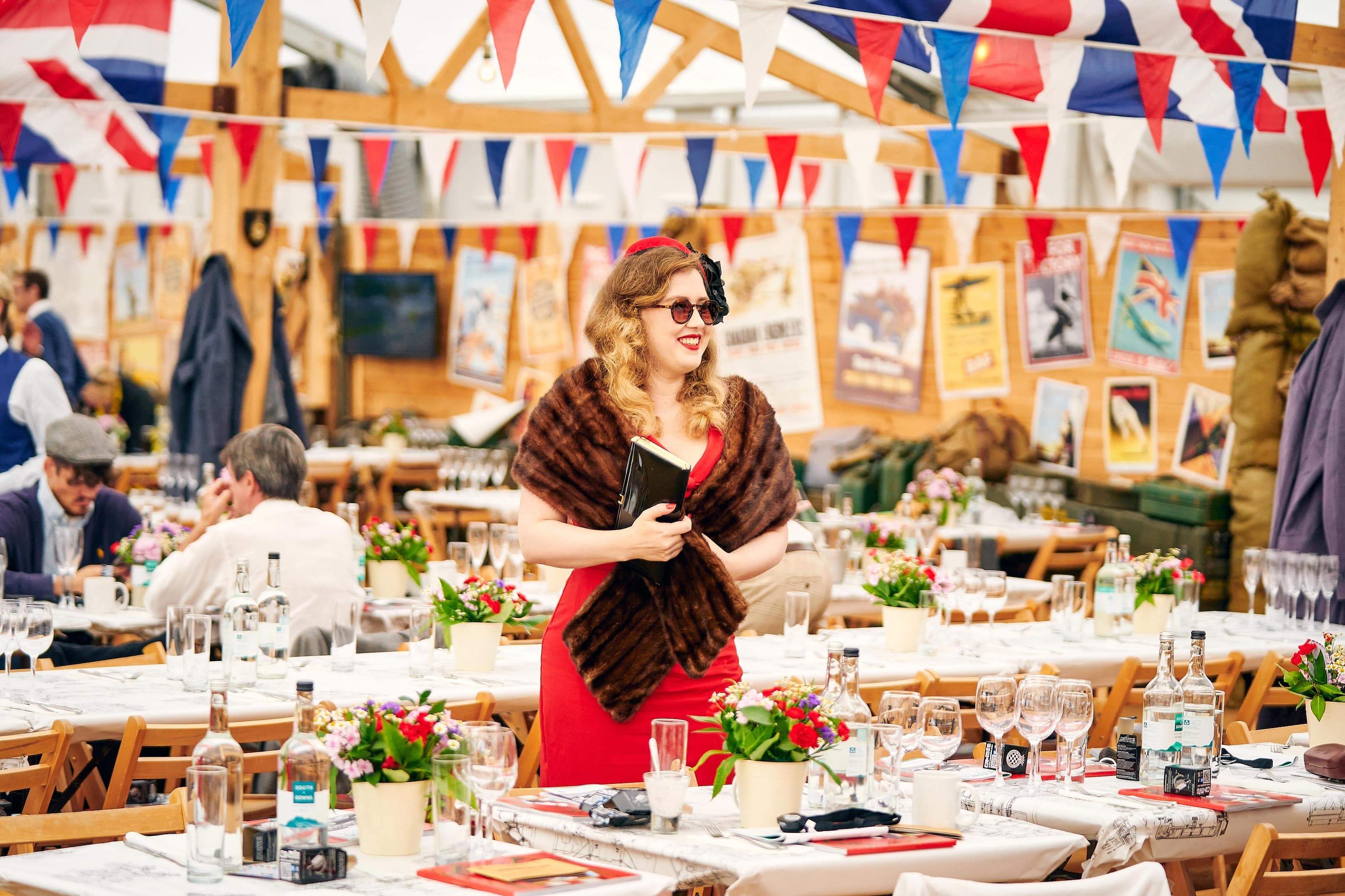 Goodwood Revival Mess Pavilion interior with visitors in period dress