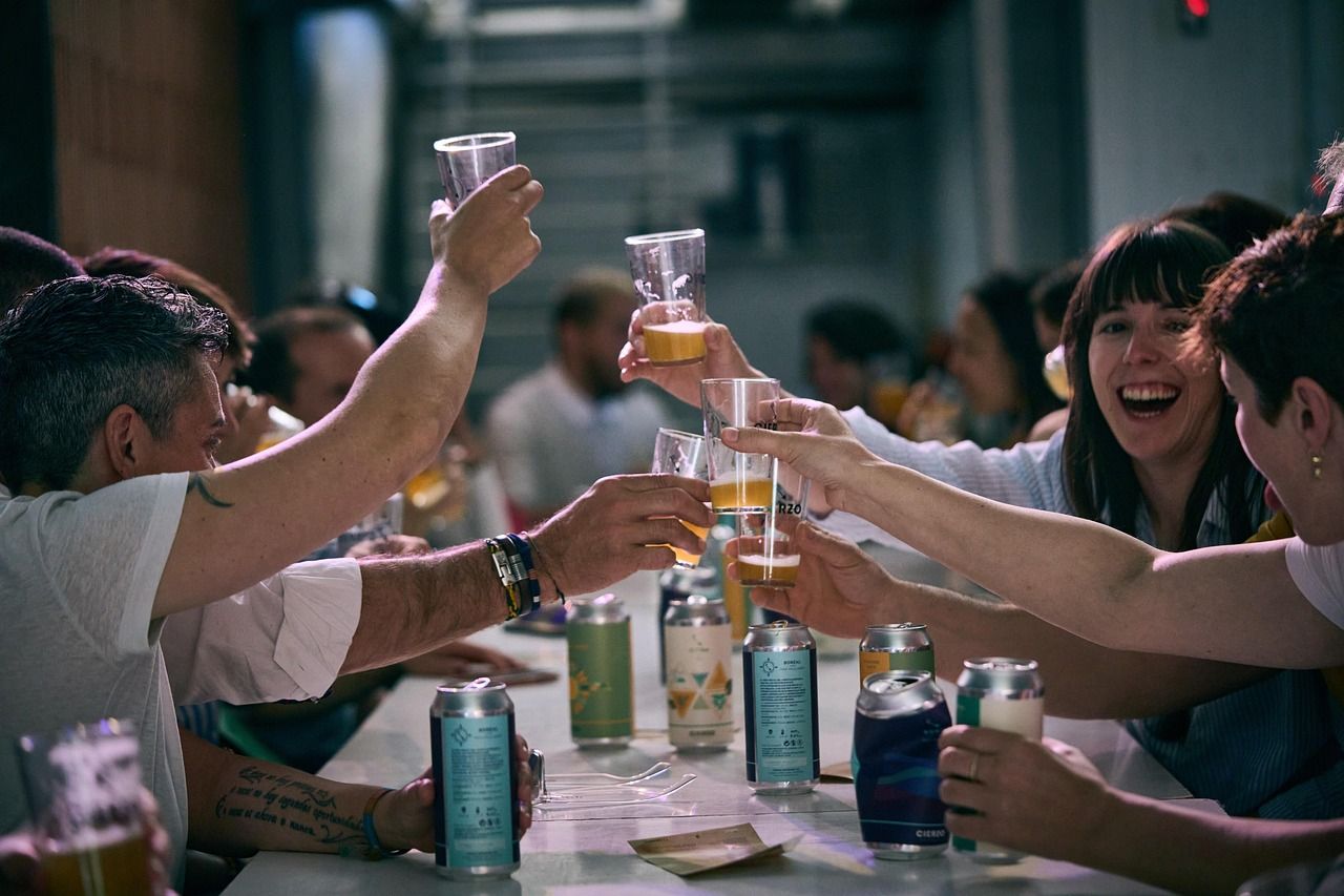 Friends raising glasses of craft beer at a beer festival