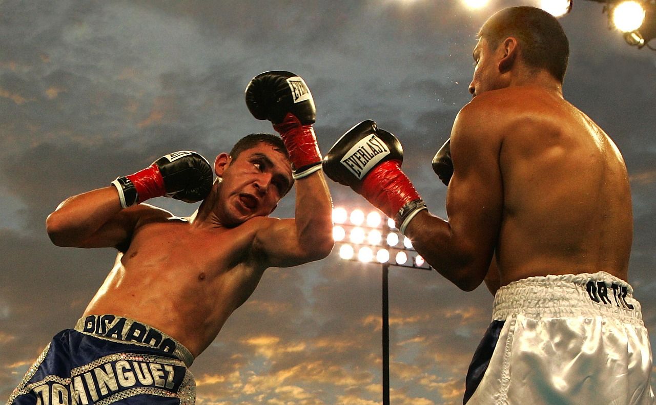 Boxing action in the ring during a heavyweight championship bout