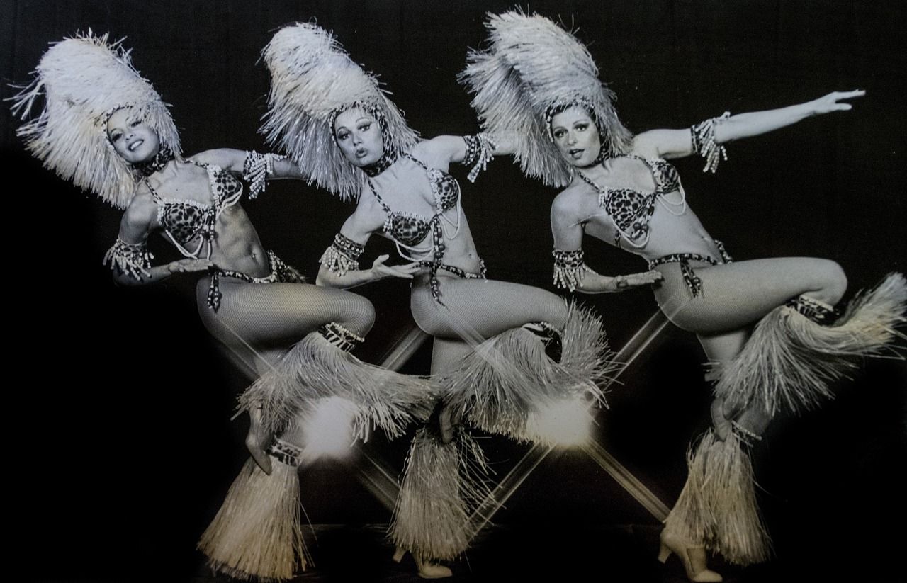 Cabaret showgirl in sequined costume performing on stage