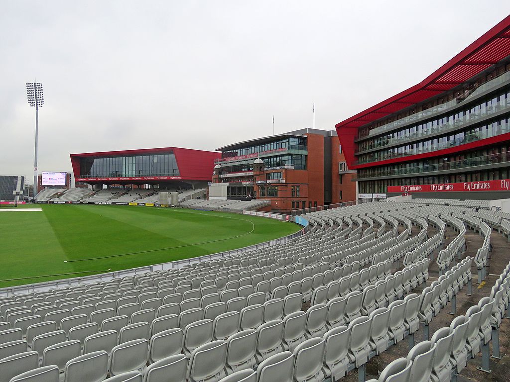 Cricket being played on a green pitch, evoking the behind-closed-doors 2020 series