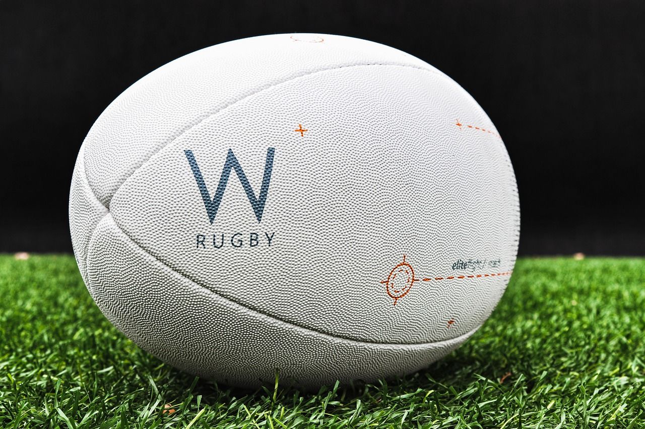 A rugby ball on grass, representing the early days of international rugby in Dublin