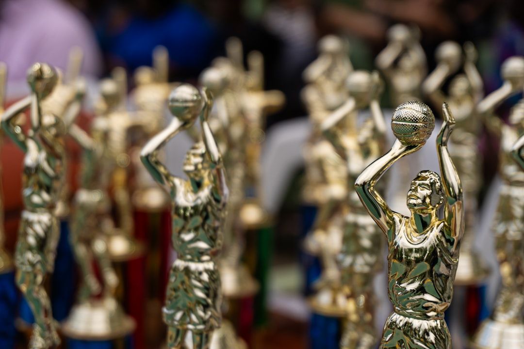 Row of golden trophies representing music award achievements