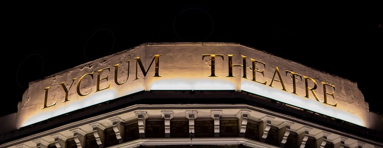 West End theatre in London illuminated at night