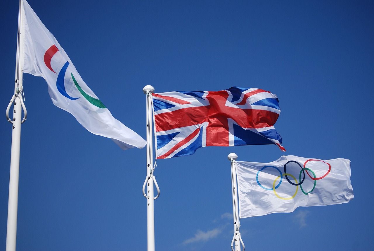 British flags waving in celebration, evoking the patriotic spirit of the Last Night of the Proms