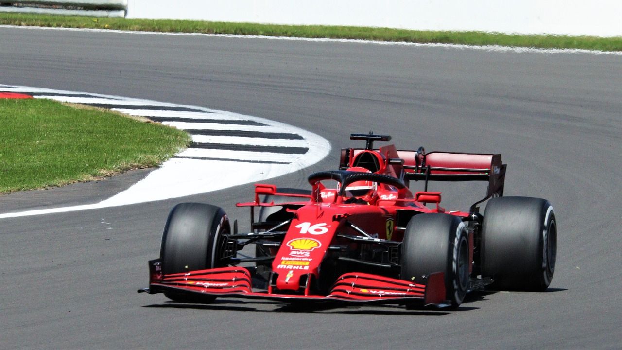 Modern Formula 1 car racing at a Grand Prix