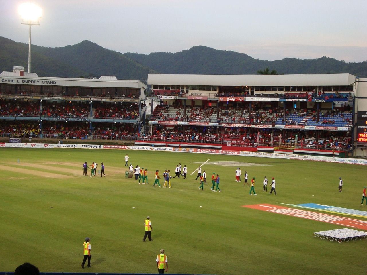 Cricket stadium with spectators watching a match