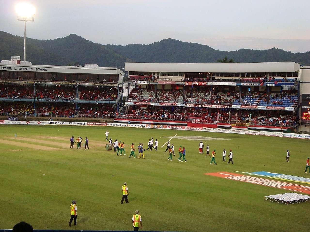 Cricket stadium with spectators watching a match