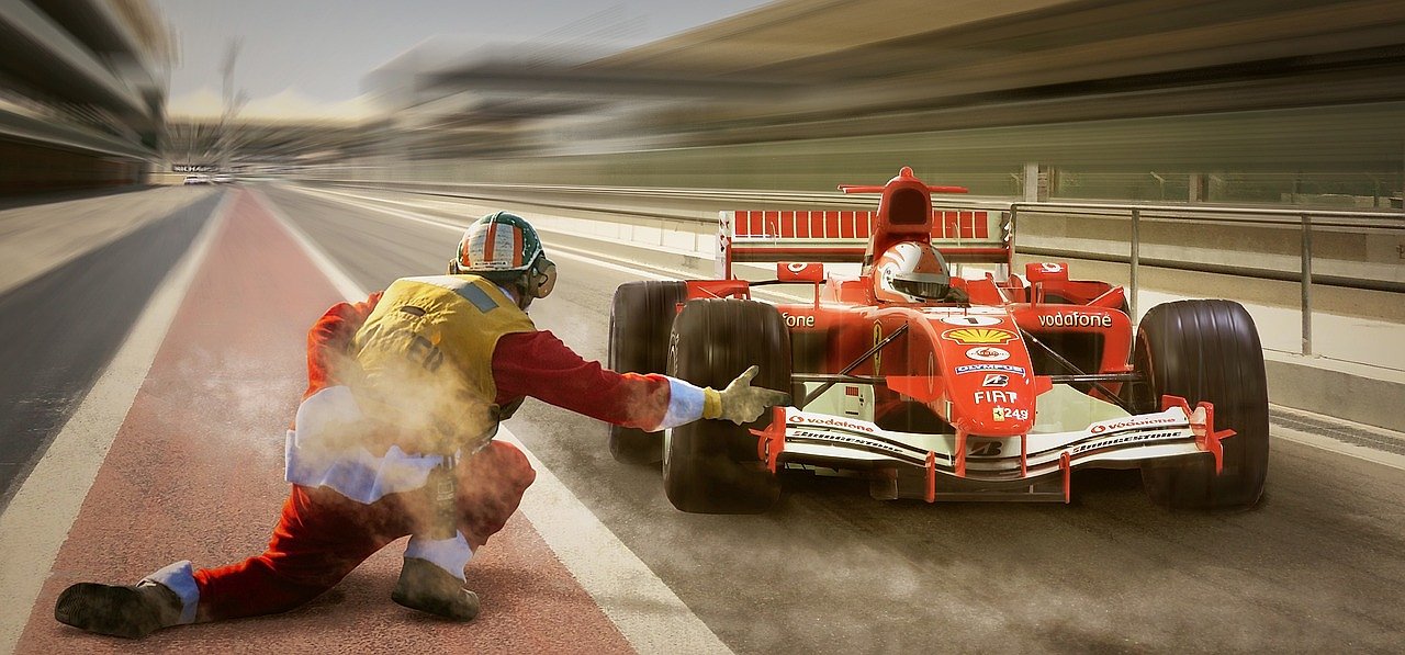 Formula 1 car in the pit lane, representing the modern era of Grand Prix racing at Spa-Francorchamps