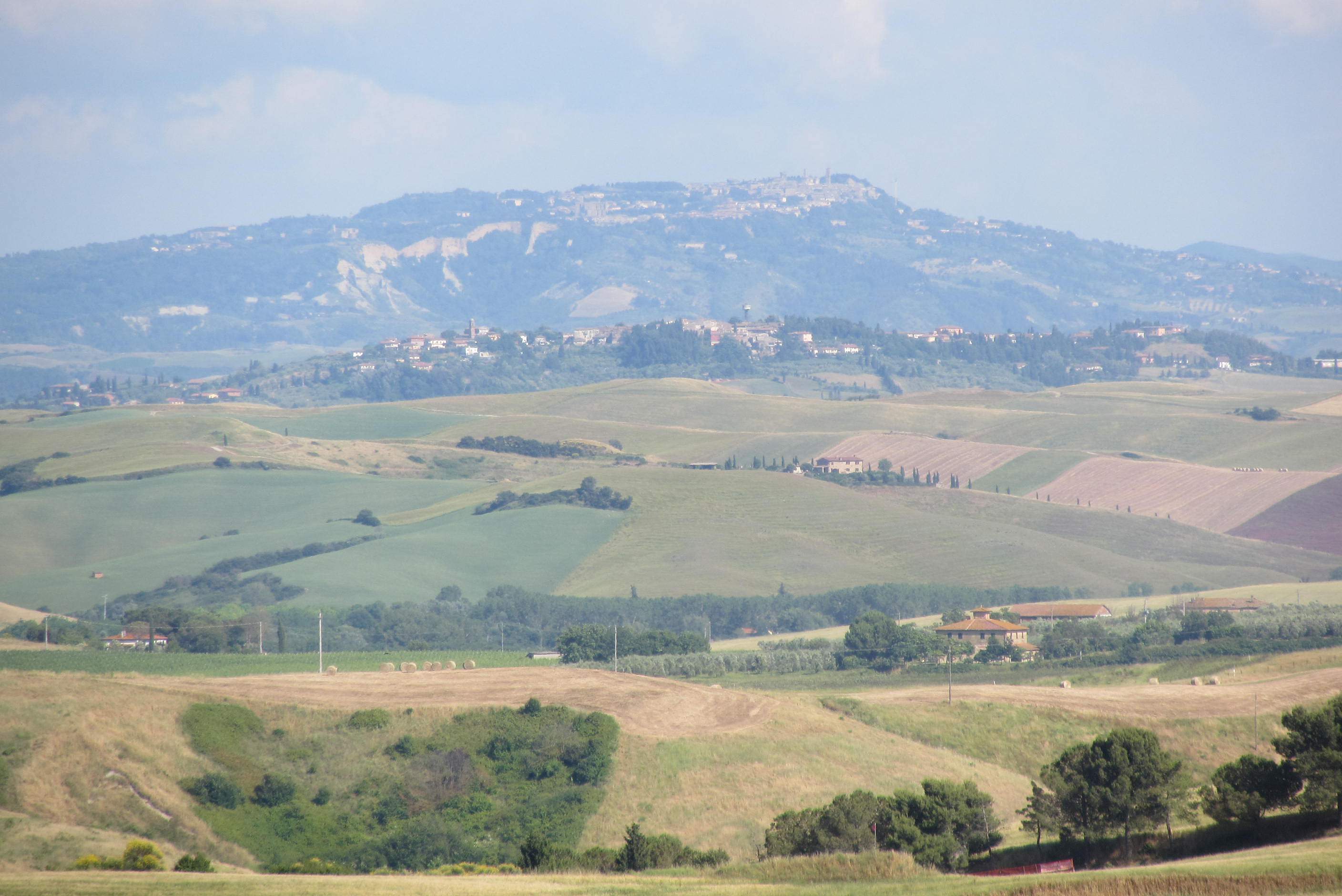 Rolling Tuscan hills with hilltop villages near Lajatico