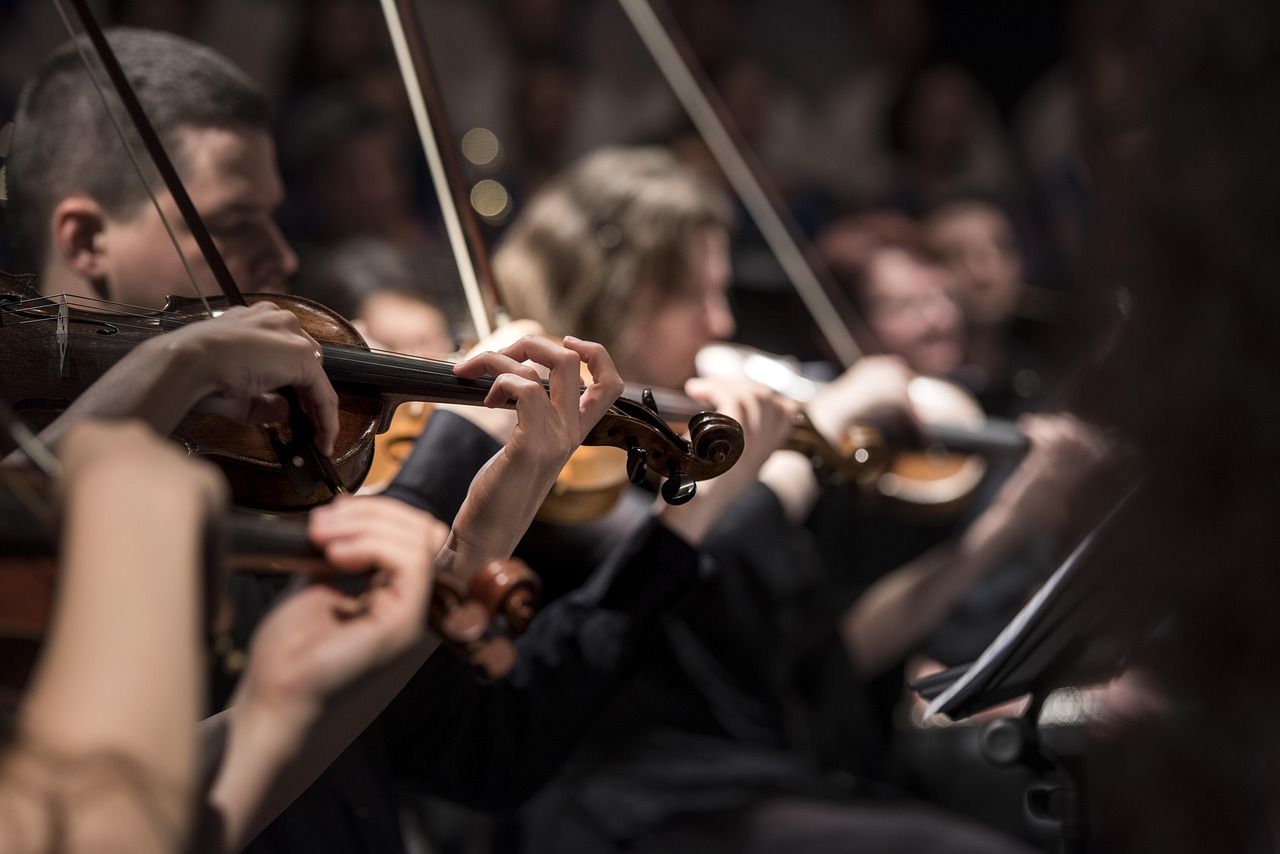 Orchestral musicians performing, honouring the legacy of Sir Henry Wood