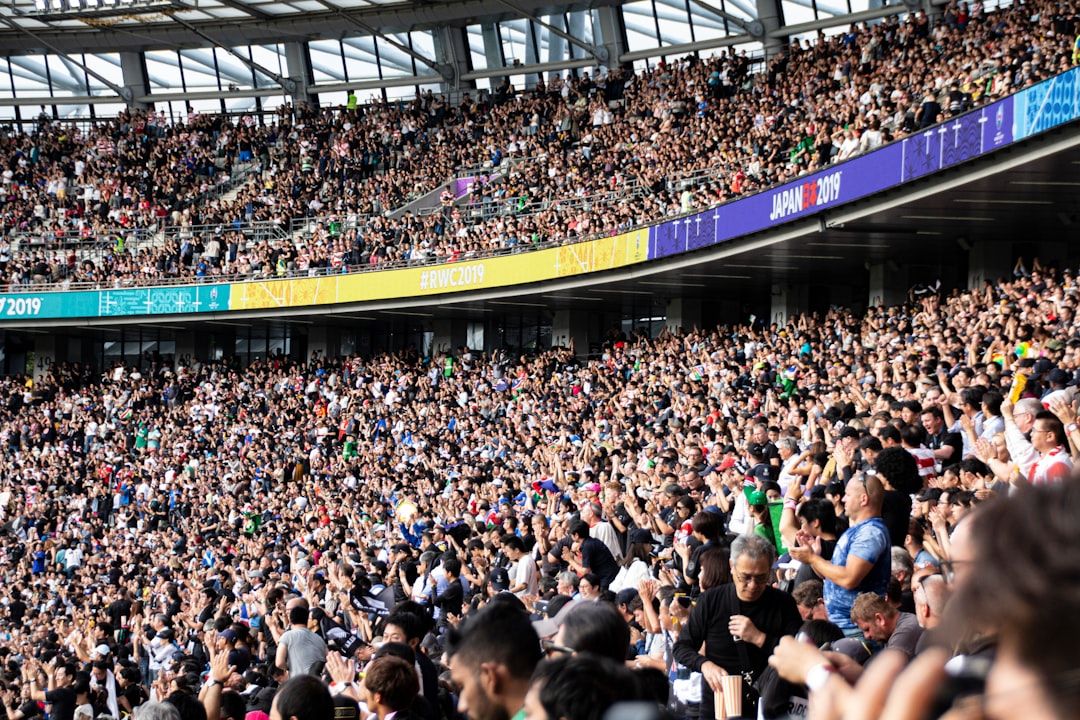Cheering crowd at a rugby stadium, capturing the atmosphere of a Six Nations match