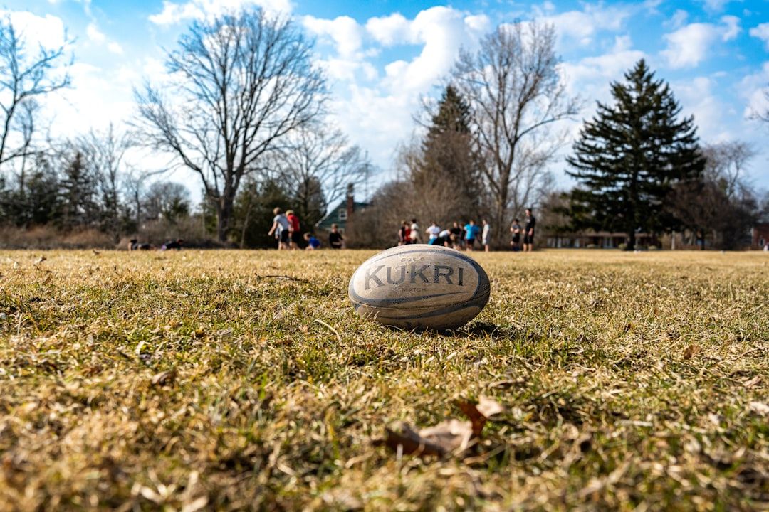 A rugby ball on a green field, symbolising the post-war resumption of international rugby
