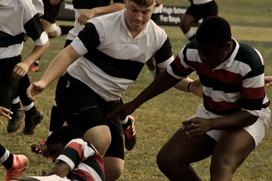 Rugby players engaged in a scrum during an international match