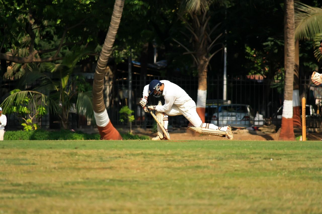 Cricket batsman playing a defensive stroke during an ODI match