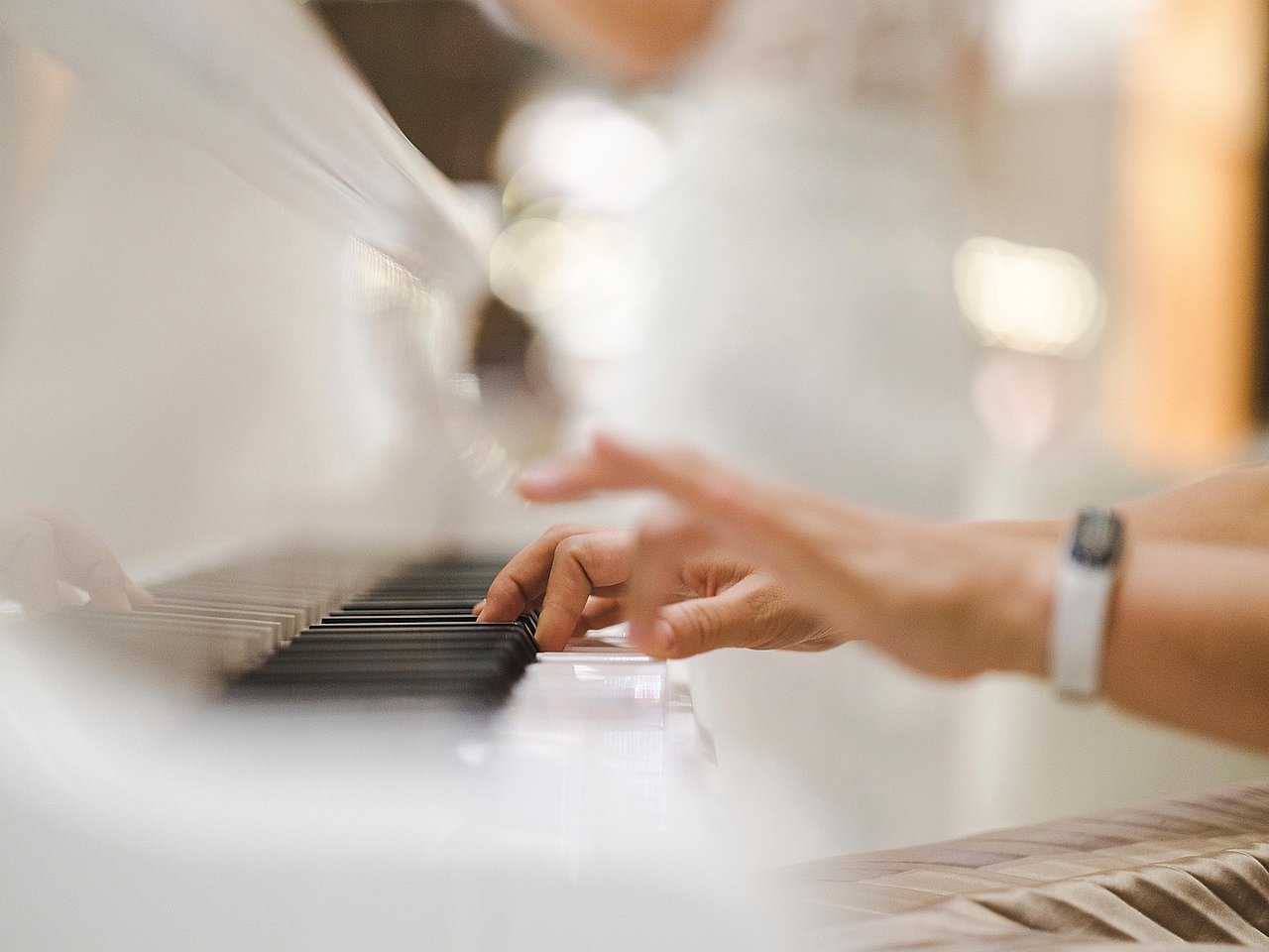 Pianist performing at a grand piano, reflecting Elton John's signature performance style