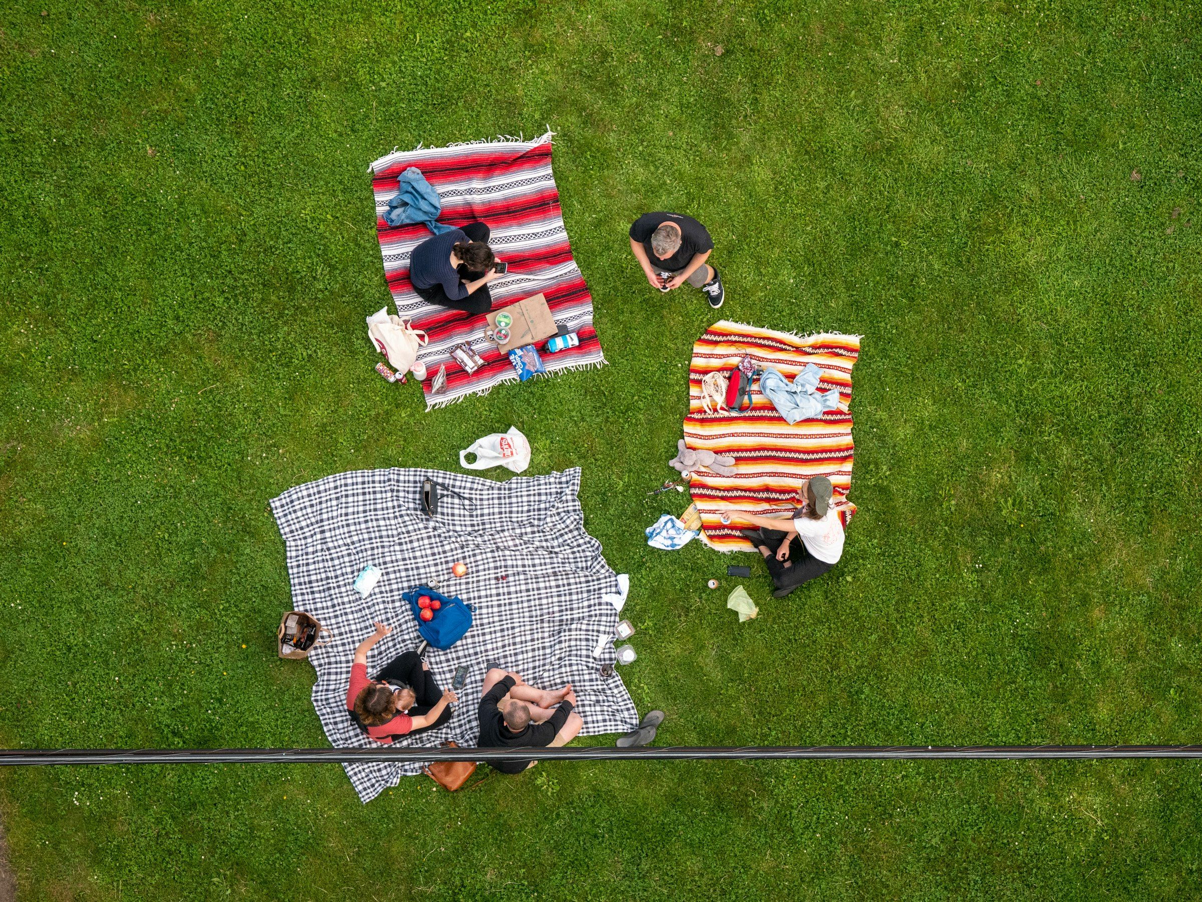 Glyndebourne Festival Opera (red white and black flag on green grass field)