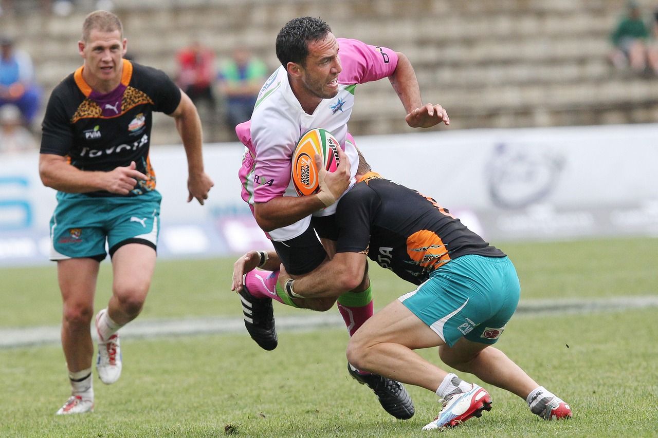 Rugby player running with the ball during a match
