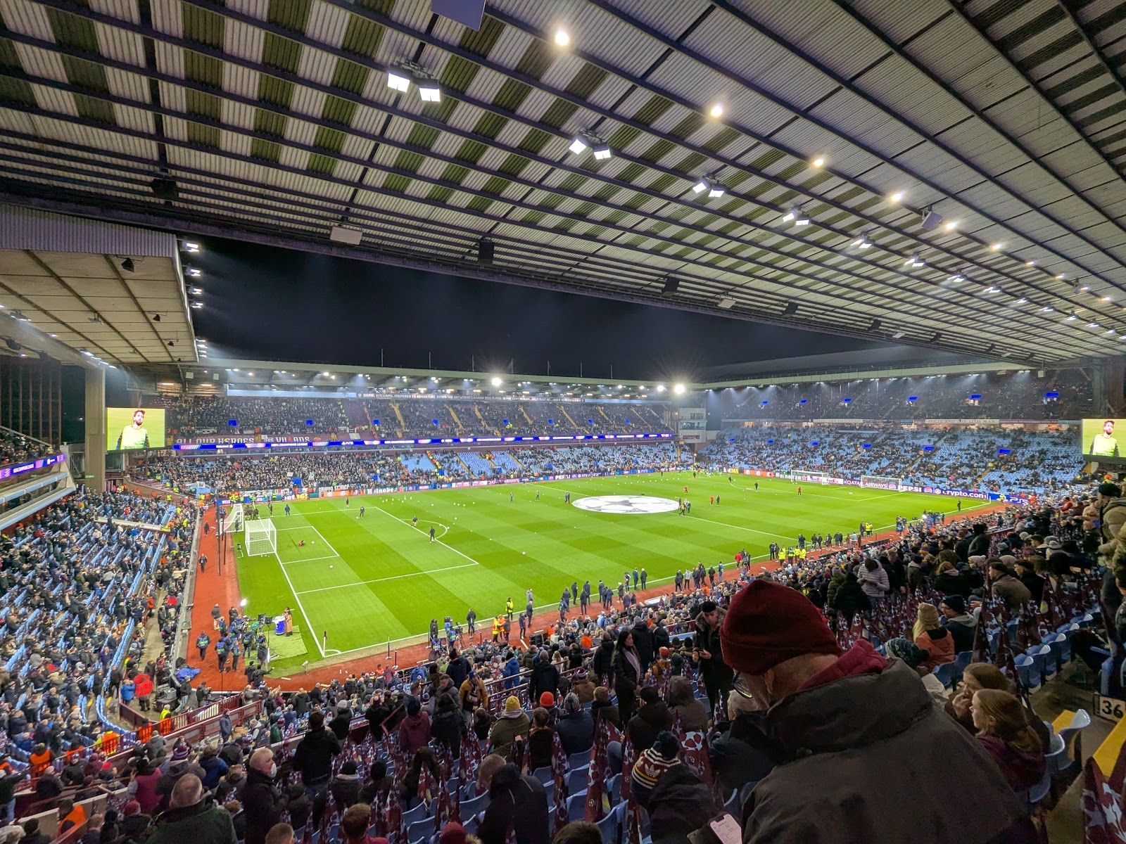An elevated side-on view across the Villa Park pitch towards the opposite stand