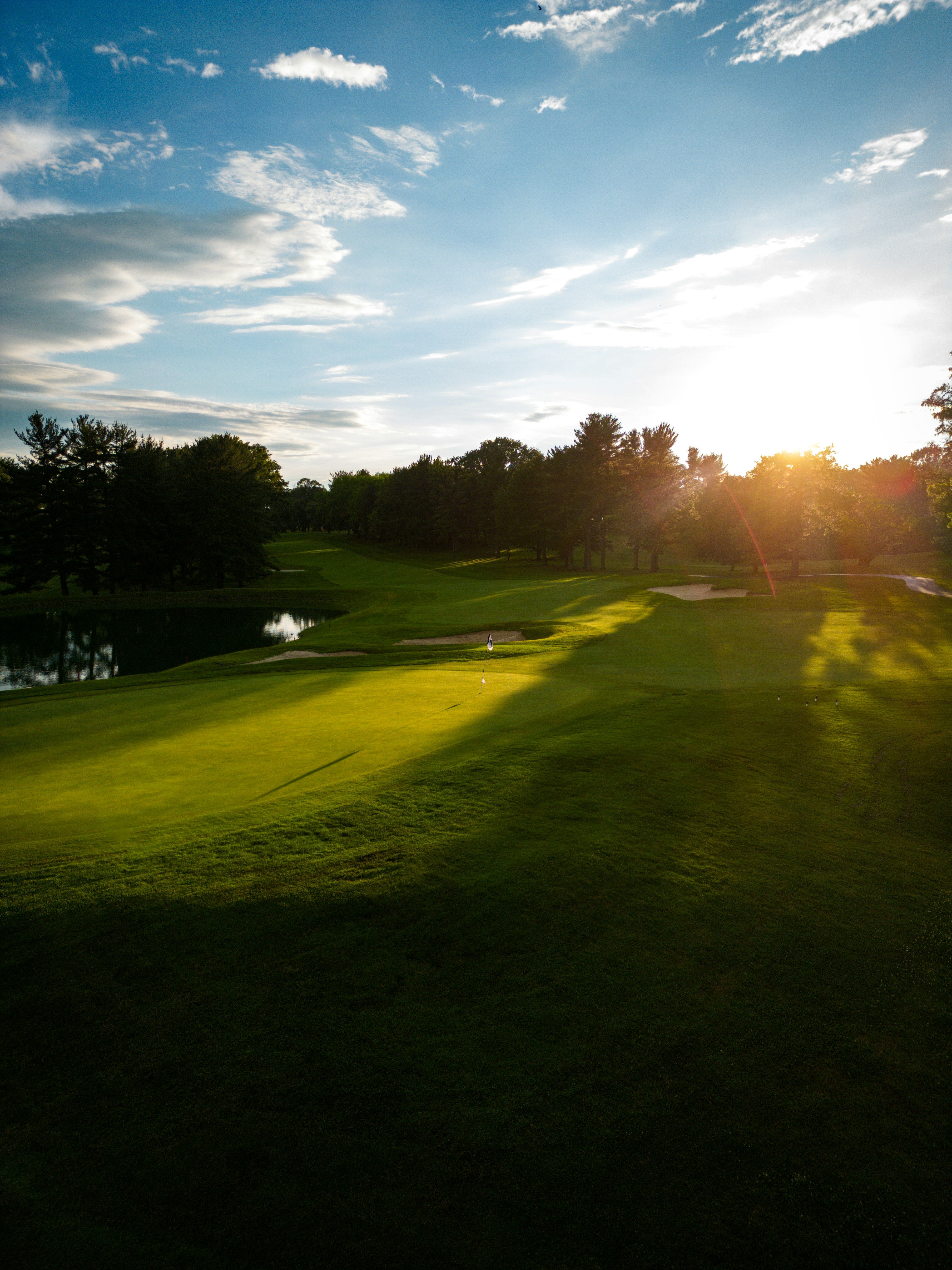 Sun shining over a golf course