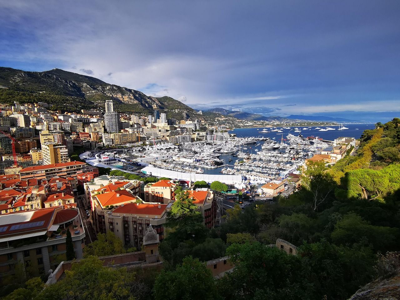Port of Monaco with luxury yachts and Monte Carlo skyline