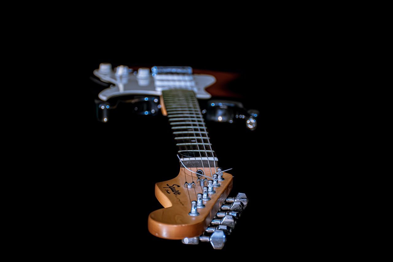 Close-up of an electric guitar in blue tones