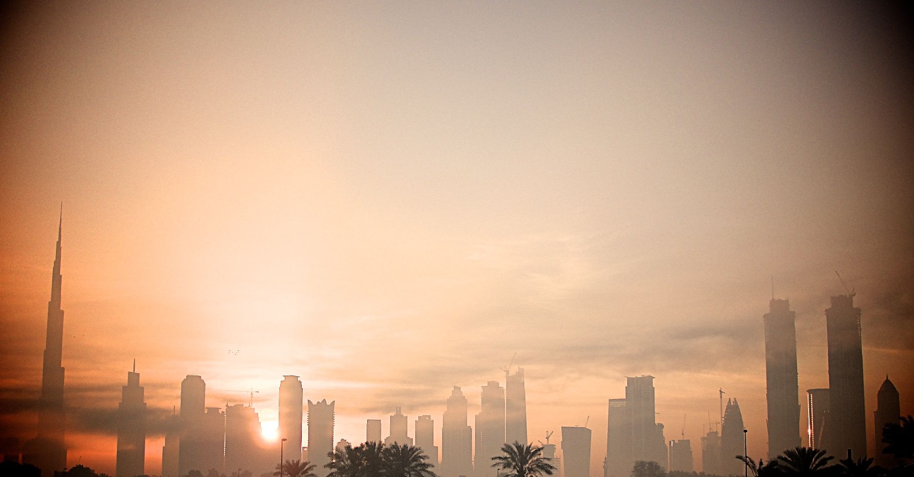 Dubai skyline at dawn under a clear desert sky
