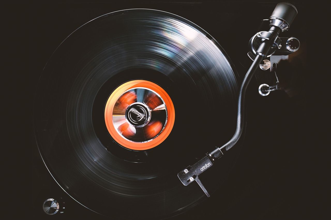 Vinyl record on a turntable, evoking the era of Jeff Beck's groundbreaking recordings