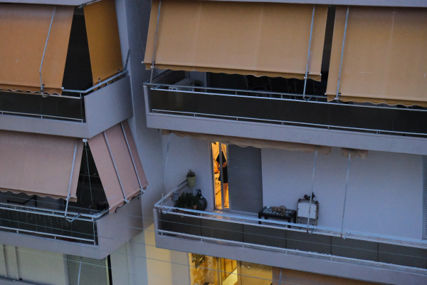 Athens polykatoikia balconies with orange awnings