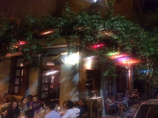 The bohemian interior of Seychelles neo-taverna in Metaxourgeio, Athens — a cult gathering spot for mezes and natural wine