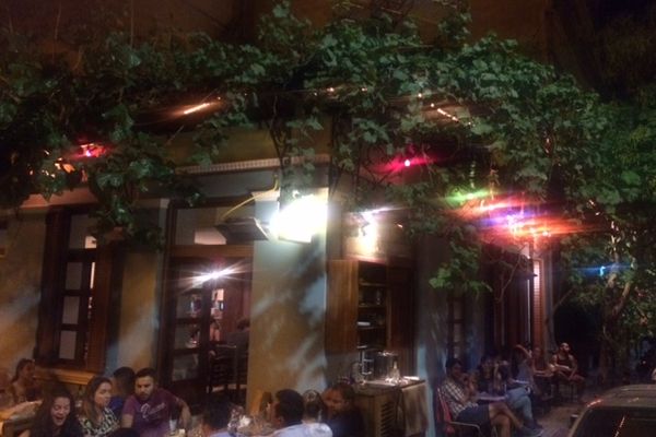 The bohemian interior of Seychelles neo-taverna in Metaxourgeio, Athens — a cult gathering spot for mezes and natural wine
