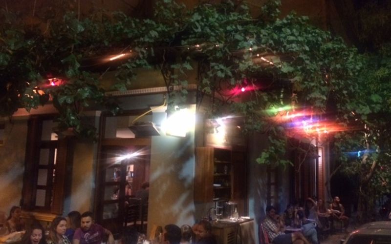 The bohemian interior of Seychelles neo-taverna in Metaxourgeio, Athens — a cult gathering spot for mezes and natural wine