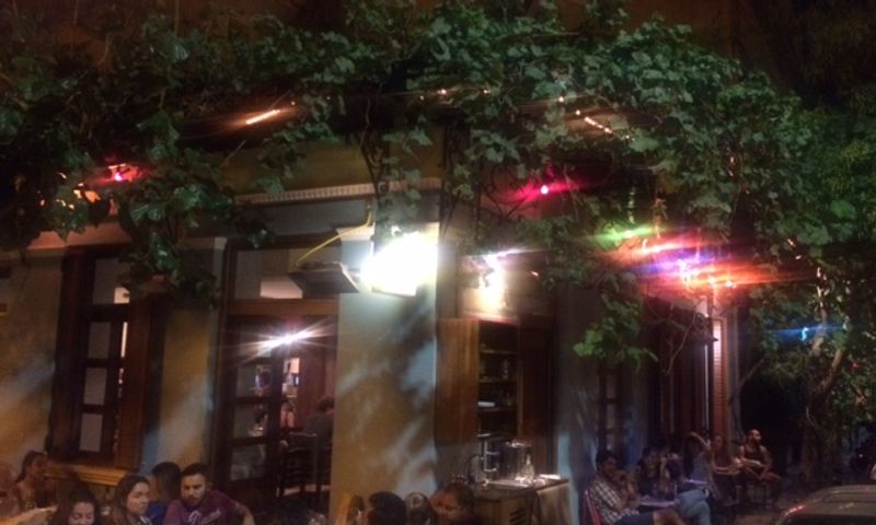 The bohemian interior of Seychelles neo-taverna in Metaxourgeio, Athens — a cult gathering spot for mezes and natural wine