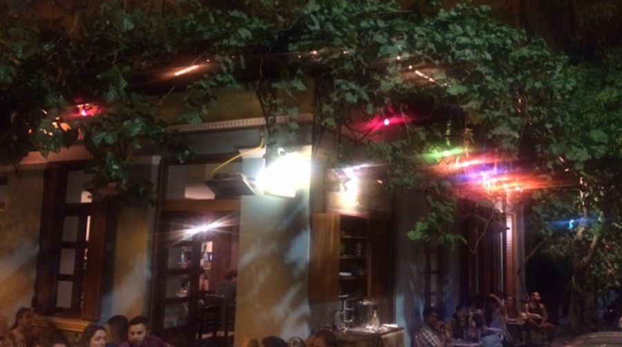 The bohemian interior of Seychelles neo-taverna in Metaxourgeio, Athens — a cult gathering spot for mezes and natural wine