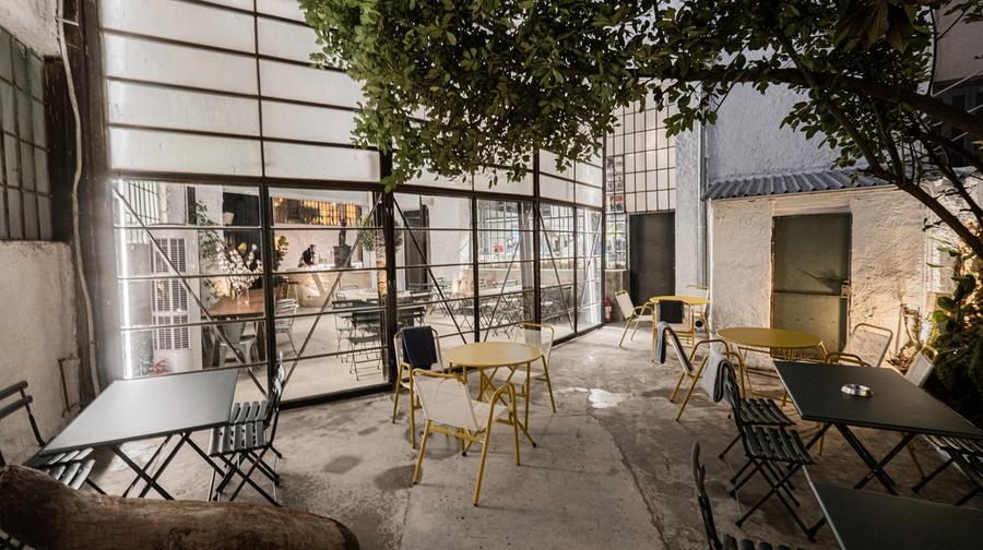 Line Wine Bar Athens — warm interior with shelves of natural wine