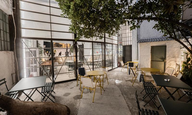 Line Wine Bar Athens — warm interior with shelves of natural wine