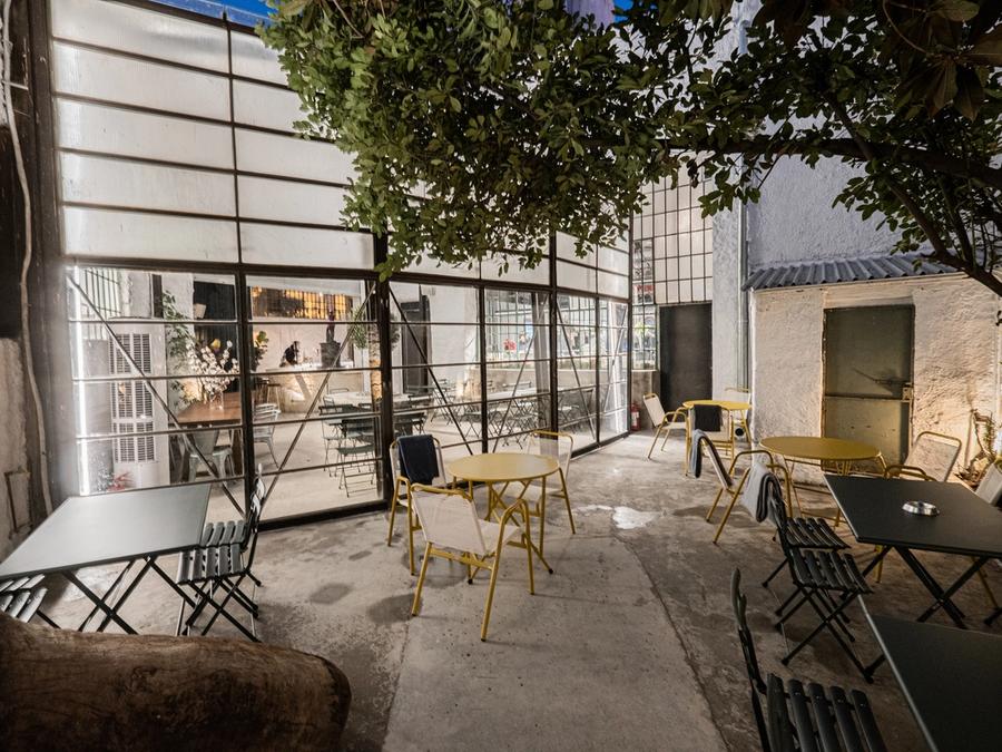 Line Wine Bar Athens — warm interior with shelves of natural wine