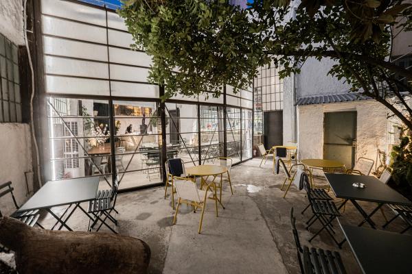 Line Wine Bar Athens — warm interior with shelves of natural wine